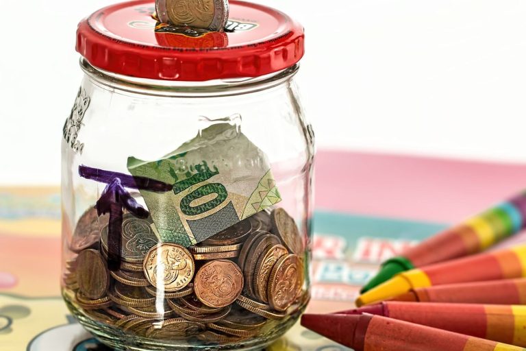 Retirement Savers Are Pouring Money Into Index Funds A calculator, notebook and glasses on a desk